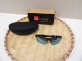a pair of sunglasses and a hat on a tray
