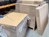 a large amount of boxes stacked on pallets in a warehouse