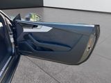 the door of a car is open on the concrete floor