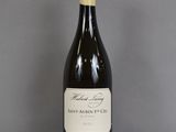 a bottle of wine that is sitting on a table