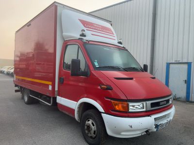 a red delivery truck parked in front of a building
