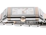 a close up of a wrist watch with a heart on it