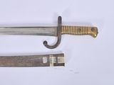an old knife and a small knife on a white surface