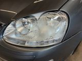 a close up of a car ' s headlight on the front of the car