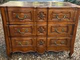 an old wooden dresser with many drawers on top of it
