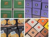 many boxes of coffee on display in a store