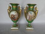 pair of green and gold vases with pictures of people on them