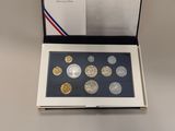 a box of coins with a picture of a man on it