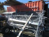 a truck that is parked next to a pile of metal