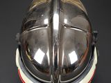 an image of a helmet on a black background with a red stripe