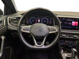 the interior of a volkswagen vehicle with a steering wheel and dashboard controls
