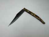 a knife that is laying on a table
