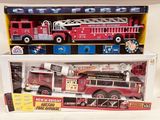 a toy fire truck and a toy firetruck in a box