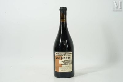 a bottle of wine that is sitting on a table