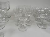a lot of empty wine glasses sitting on a table