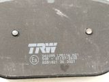 a close up of a small metal object with a tag on it