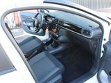 the interior of a car with the door open showing the dashboard