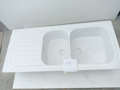 a white sink that is sitting on top of a table