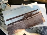 many old photos of a plane on a table