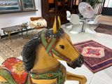 a statue of a horse with a saddle on it ' s back