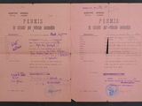 an old document with purple writing on it sitting on top of a table