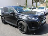 a picture of a black land rover parked in a parking lot
