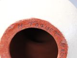 an image of a vase with a hole in it