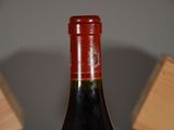 a bottle of wine that is sitting on a table