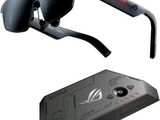 a pair of sunglasses that are next to a remote control