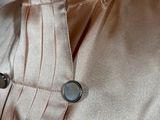 the back of a dress shirt with buttons on a mannequin mannequin mannequin mannequin mannequin mannequin mannequin mann