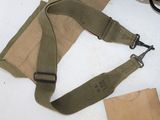 an image of a pair of scissors sitting on a table next to a bag