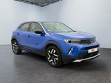 a blue toyota c - hr suv parked in a large room