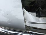 a car that has been damaged and is sitting on the ground