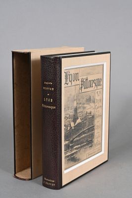 a book with a picture of a train coming out of it