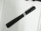a pen and a pair of scissors laying on a table