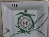 a small square plate with a clock on it