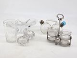 three pieces of glass and silverware sitting on a white surface