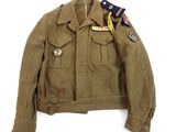 an old military jacket with a patch on the shoulder