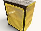 une boîte jaune avec un couvercle noir posée sur une surface blanche