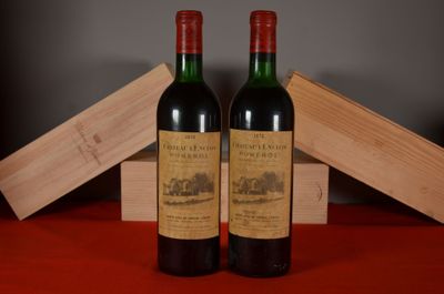 two bottles of wine sitting next to each other on a table