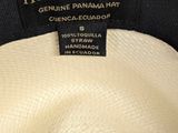 an image of a white hat with a black label on it