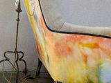 a plant that is growing out of the back of a chair