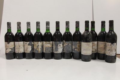 several bottles of wine are lined up in a row on a table