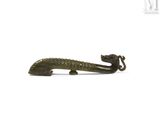 figurine représentant un lézard sur fond blanc, avec un fond blanc