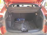 a trunk of a car with a bag in the trunk