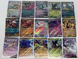 the pokemon cards are lined up on a white surface