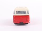 a small red and white bus on a white surface