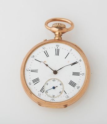 an old gold pocket watch with roman numerals and roman numerals on the face