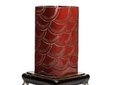 an image of a red candle with a black base on a white background