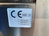 a close up of a metal object with a label on it